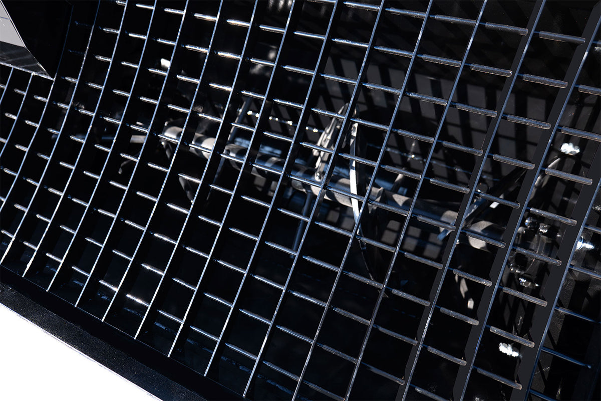 Black steel mixing grate inside MMS 48-inch concrete mixing bucket attachment
