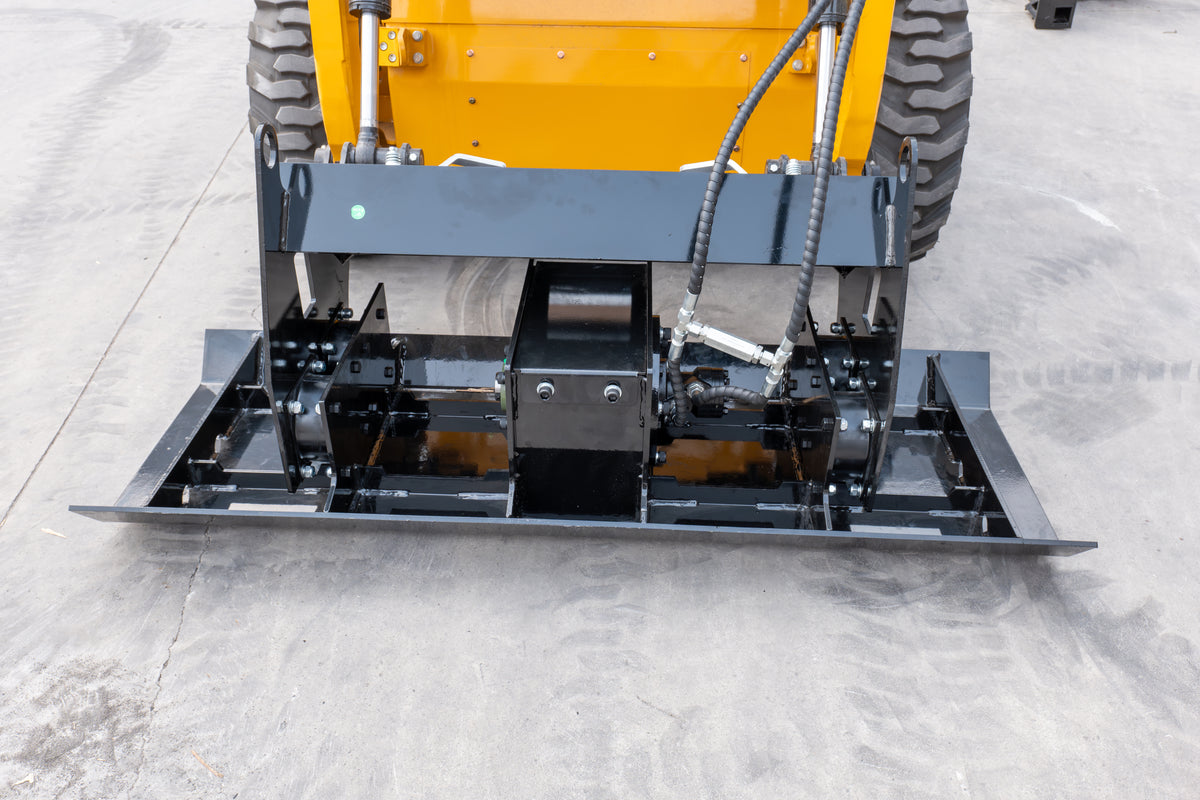 Black skid steer flat plate compactor attachment with hydraulic hoses on concrete