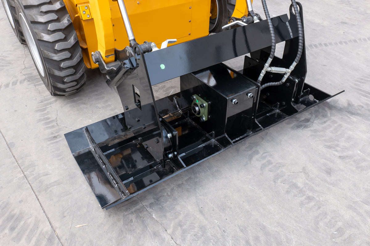 Black skid steer flat plate compactor attachment with hydraulic hoses on concrete