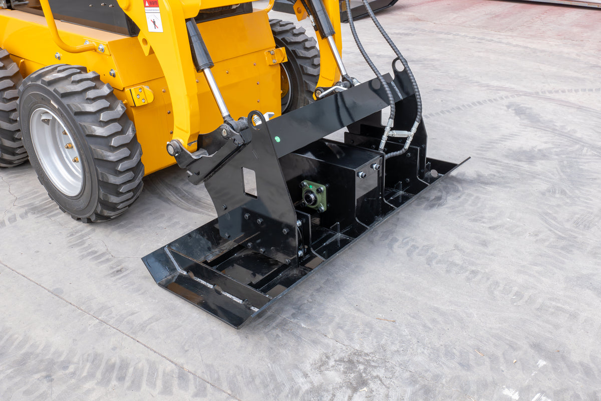 Black vibratory flat plate compactor attachment mounted on a yellow skid steer loader