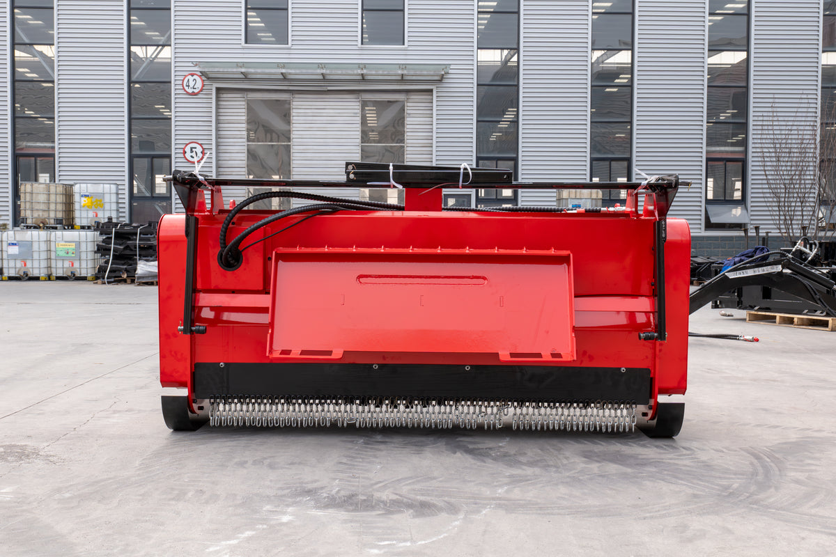 Red 72-inch skid steer mulcher attachment with cutting teeth for land clearing