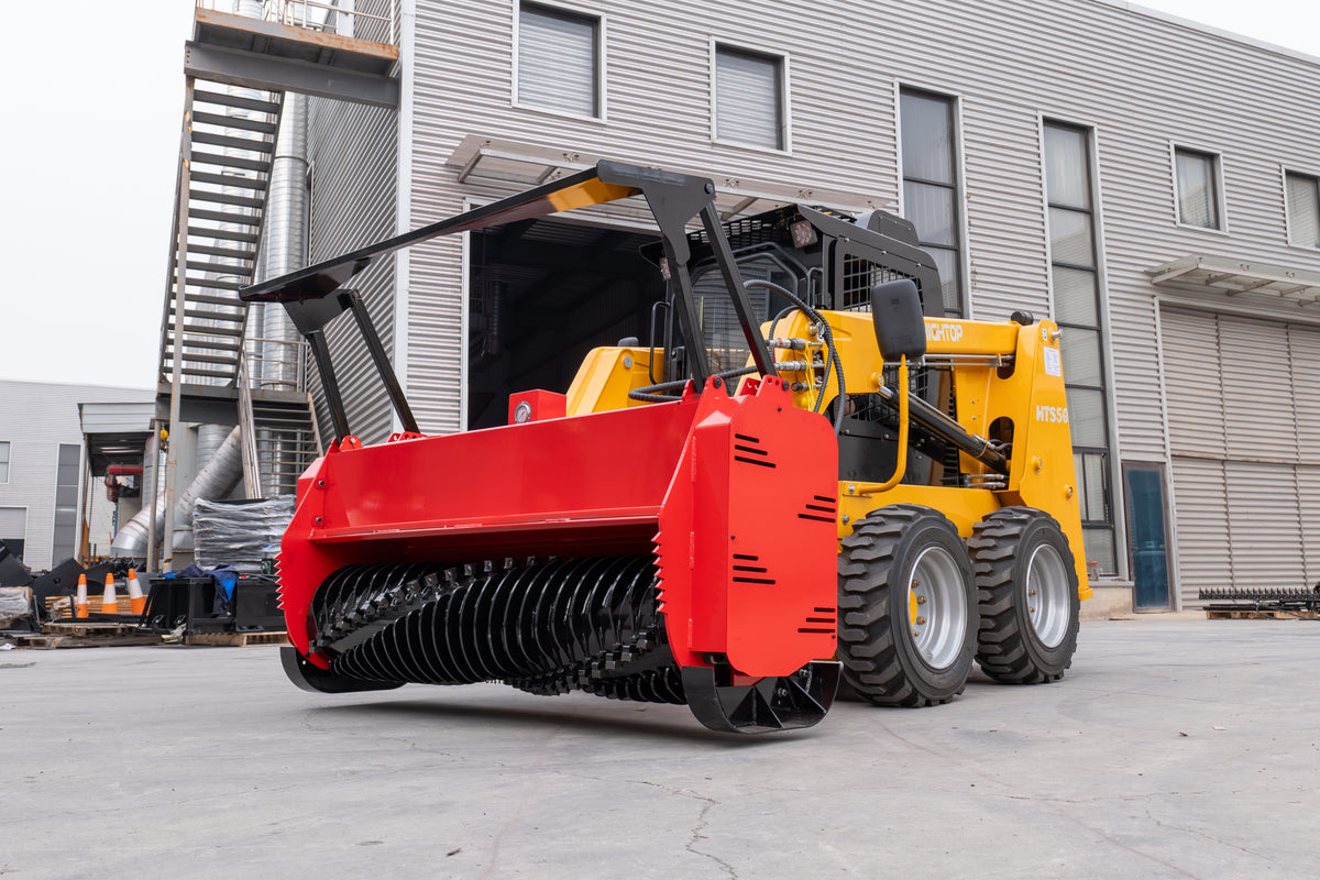 72-inch red skid steer mulcher attachment with black cutting drum on yellow loader