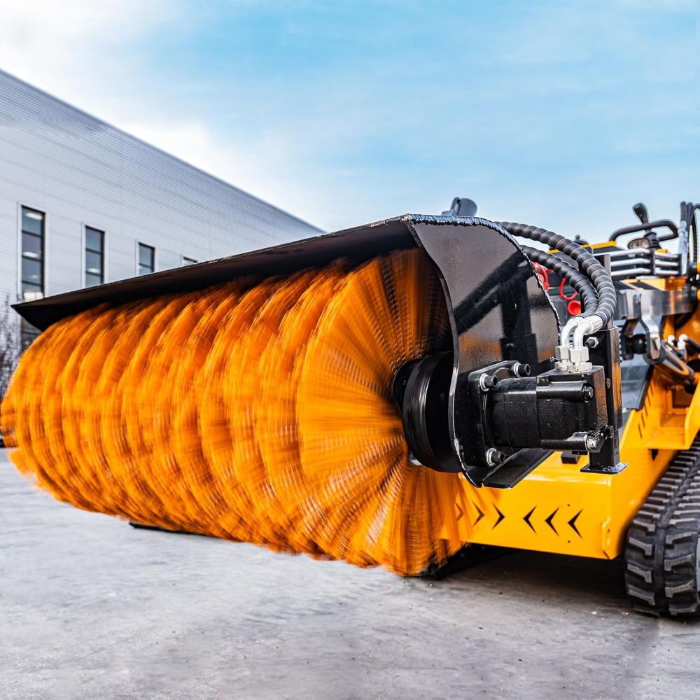 Hydraulic broom sweeper with orange bristles and black housing on MMS skid steer loader
