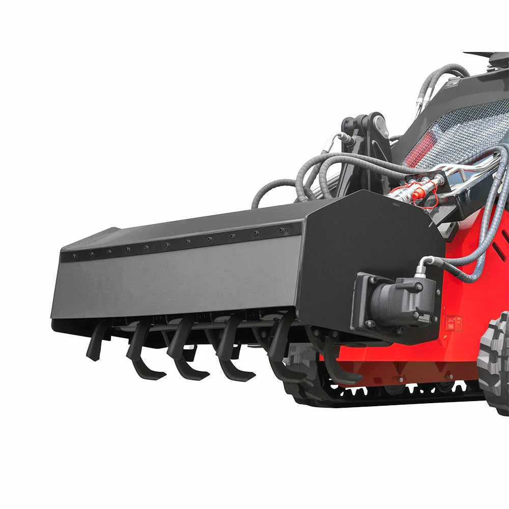 Black rotary tiller attachment with hoses mounted on MMS skid steer loader