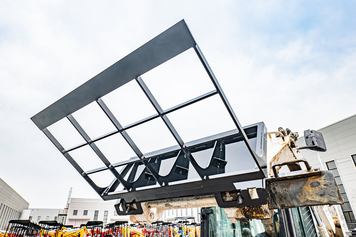 Black skid steer loader land leveler attachment with reinforced steel frame