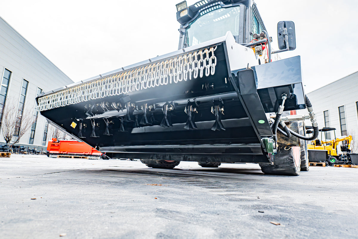 72-inch skid steer mower attachment with black cutting deck and hydraulic hoses