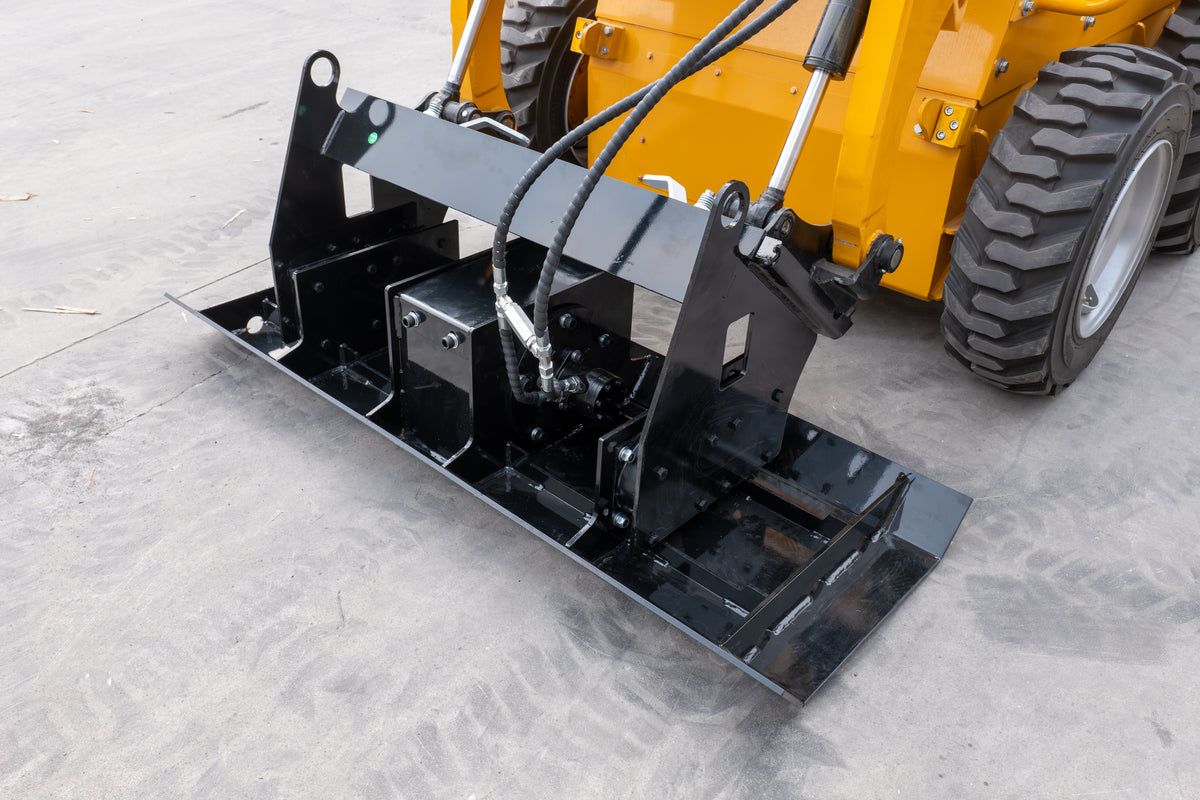 Black skid steer vibratory flat plate compactor attachment on concrete