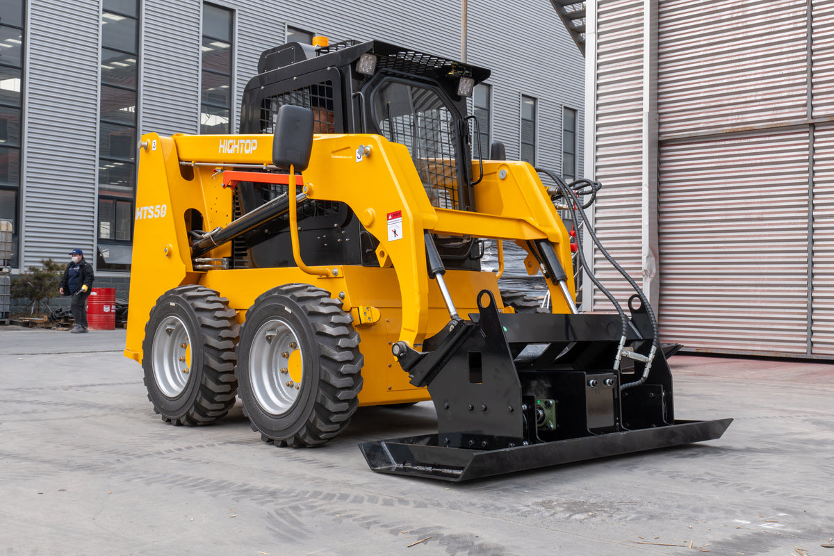 Yellow skid steer loader with black vibratory flat plate compactor attachment